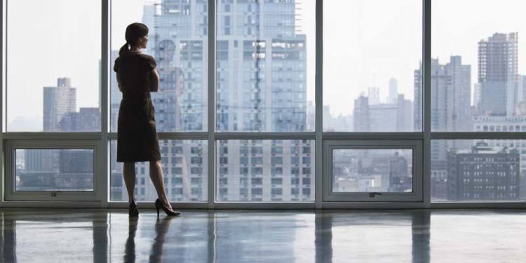 Business woman looking out window