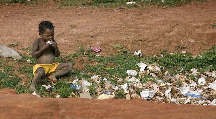 A child scavenges for food in a garbage pit near Malanje, Angola. United Methodist bishops in Africa have issued a Sept. 11 letter outlining new actions to combat poverty on the continent. The bishops that make up the church's African College of Bishops expressed