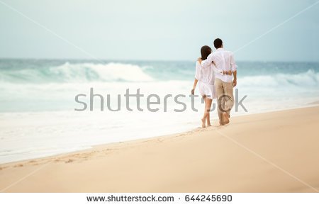 back-view-romantic-couple-walking-beach